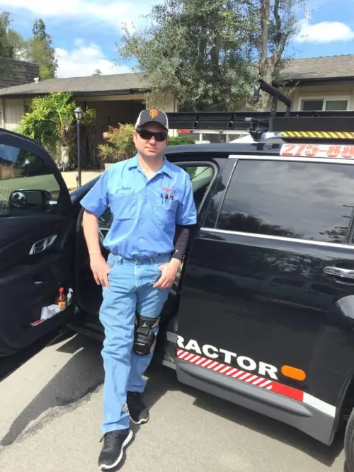 Daniel, founder of Sequoia Air Co. Fresno, standing by his service truck